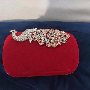 Statement peacock clutch